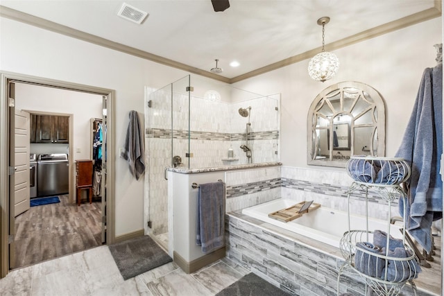 bathroom with visible vents, ornamental molding, a shower stall, and a bath