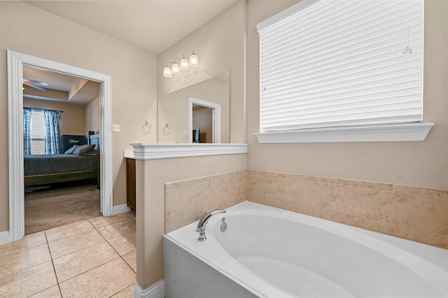 2601 Sabine Cir, Royse City, TX 75189 - bathroom featuring connected bathroom, a garden tub, tile patterned flooring, and baseboards