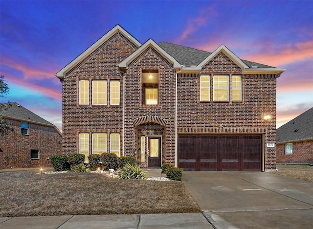 2601 Sabine Cir, Royse City, TX 75189 - traditional home featuring brick siding, an attached garage, and driveway