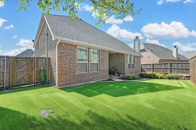 2601 Sabine Cir, Royse City, TX 75189 - back of house with brick siding, a gate, a chimney, and a shingled roof