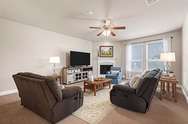 2601 Sabine Cir, Royse City, TX 75189 - living room with a ceiling fan, light colored carpet, baseboards, and a glass covered fireplace
