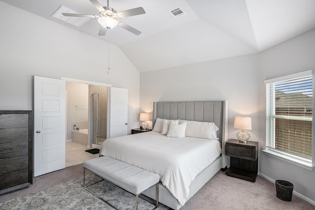 bedroom featuring visible vents, light carpet, connected bathroom, vaulted ceiling, and baseboards