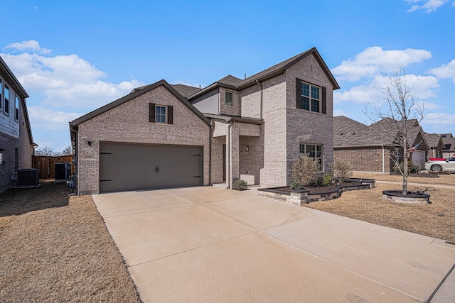 traditional-style house with cooling unit, concrete driveway, and brick siding