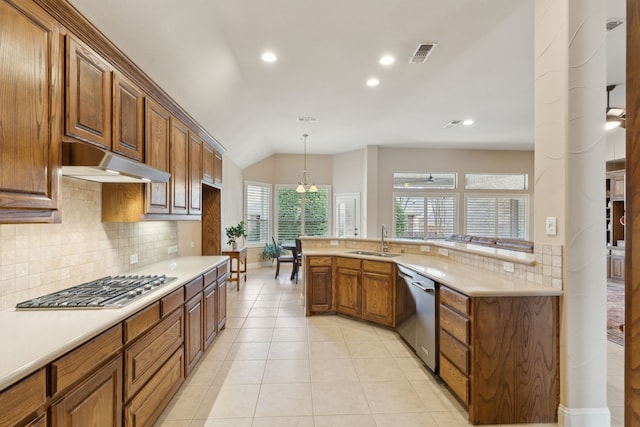 kitchen featuring visible vents, appliances with stainless steel finishes, light countertops, under cabinet range hood, and a sink