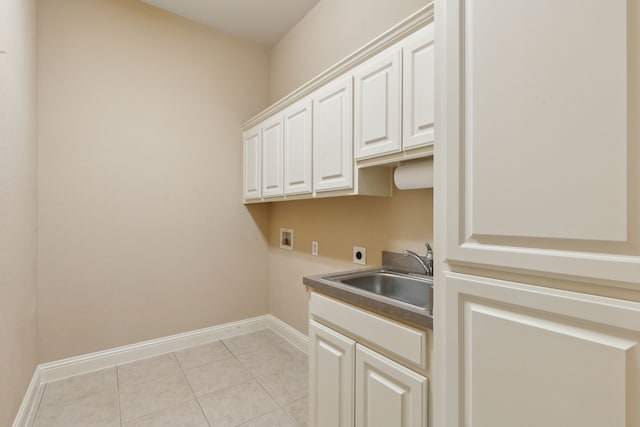 laundry room featuring hookup for a washing machine, hookup for an electric dryer, a sink, baseboards, and cabinet space