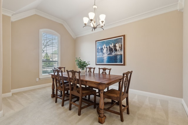 dining space featuring light carpet, baseboards, a chandelier, and vaulted ceiling