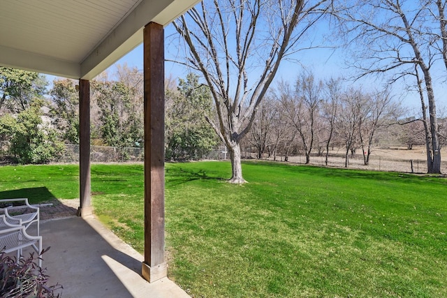 view of yard featuring fence and a patio area