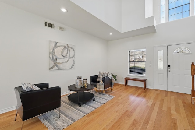 sitting room with recessed lighting, visible vents, light wood-style flooring, and baseboards