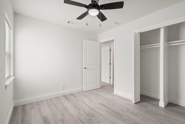 unfurnished bedroom with light wood-style floors and baseboards