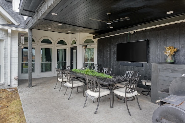 view of patio featuring outdoor dining space and ceiling fan