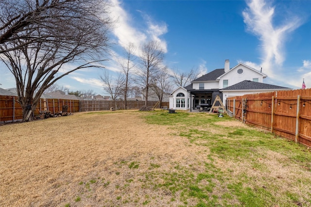 view of yard featuring a fenced backyard