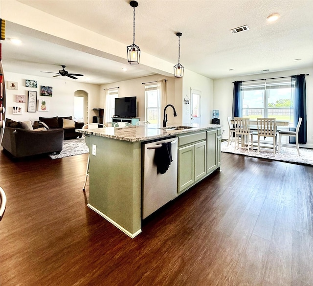 kitchen featuring open floor plan, dark wood-style floors, a sink, and dishwasher