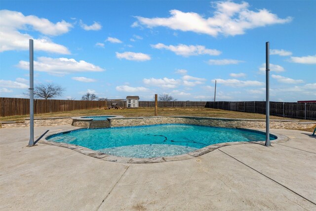 view of swimming pool with a fenced backyard, a fenced in pool, a patio, and an in ground hot tub