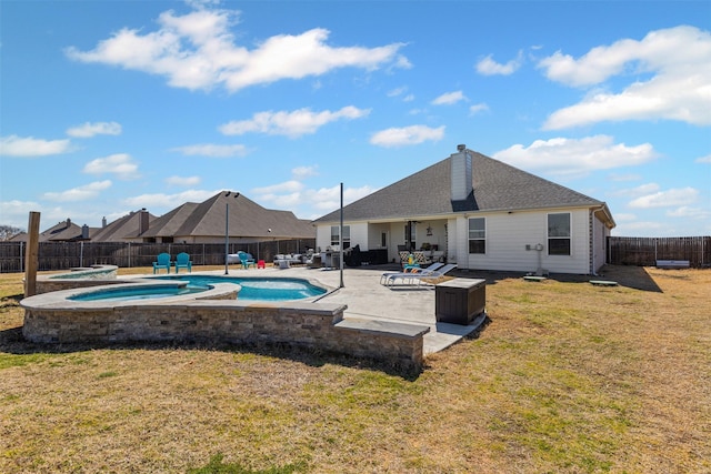back of property with a fenced backyard, a fenced in pool, a patio area, a lawn, and an in ground hot tub