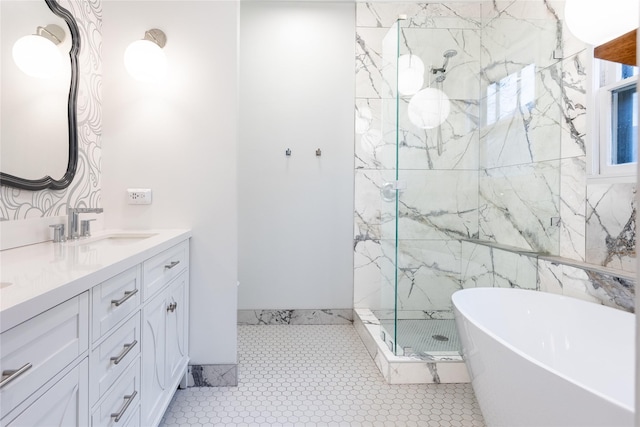 full bath featuring double vanity, a stall shower, a soaking tub, tile patterned floors, and a sink