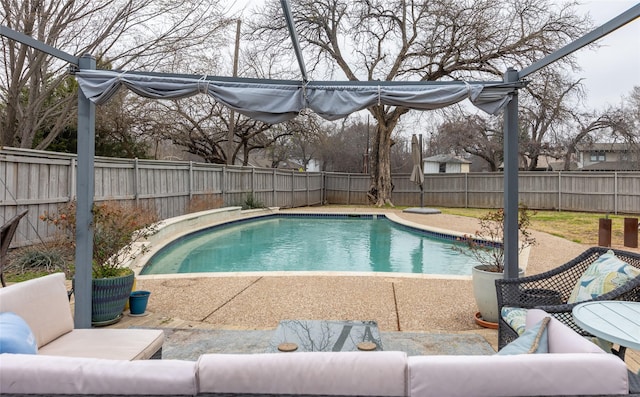 view of pool with a fenced in pool, a patio area, a fenced backyard, and an outdoor living space