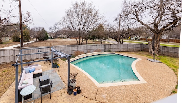 view of pool with a patio area, a fenced backyard, and a fenced in pool