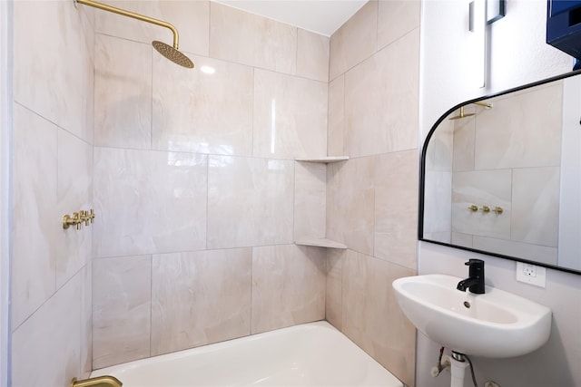 bathroom featuring shower / bath combination and a sink