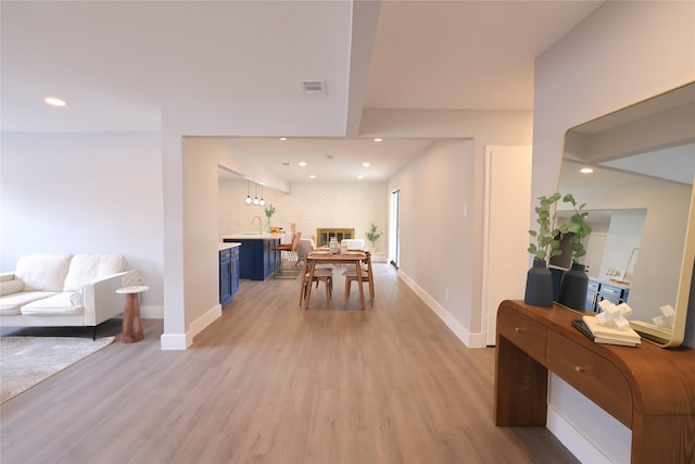 dining area featuring light wood-type flooring, visible vents, baseboards, and recessed lighting