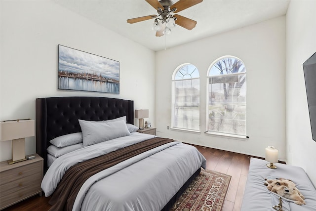 bedroom featuring dark wood-style floors and ceiling fan