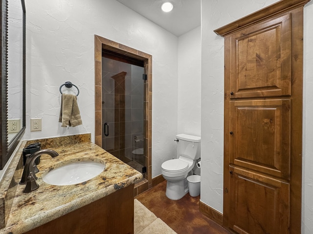 full bath with baseboards, a textured wall, toilet, vanity, and a shower stall