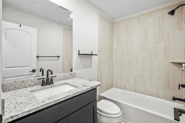 full bathroom featuring toilet, vanity, bathtub / shower combination, and visible vents