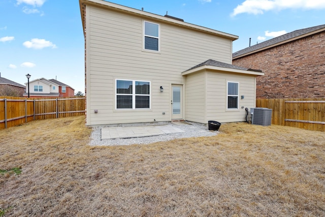 rear view of property featuring a patio, a fenced backyard, and central air condition unit