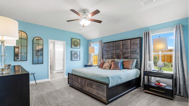 carpeted bedroom featuring baseboards, multiple windows, visible vents, and vaulted ceiling