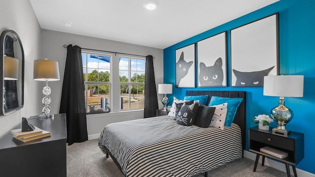 bedroom with carpet flooring and baseboards