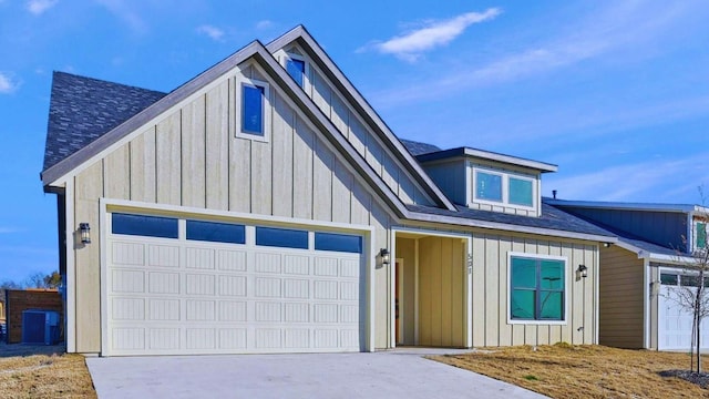 view of front of property featuring a garage, concrete driveway, and board and batten siding