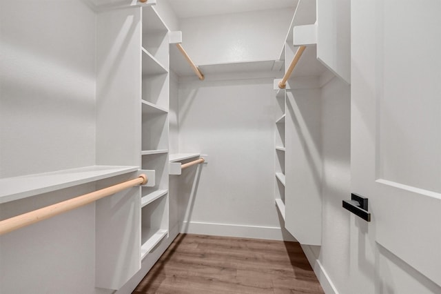 spacious closet with wood finished floors