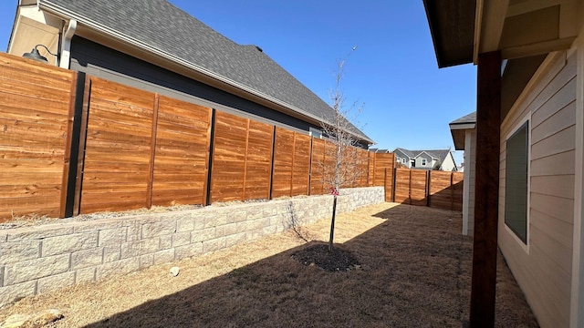 view of yard featuring a fenced backyard