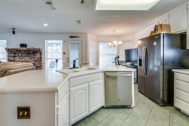 kitchen with white cabinetry, stainless steel dishwasher, a center island with sink, black refrigerator with ice dispenser, and decorative light fixtures