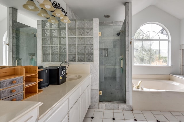 full bath with vaulted ceiling, a stall shower, vanity, and a bath