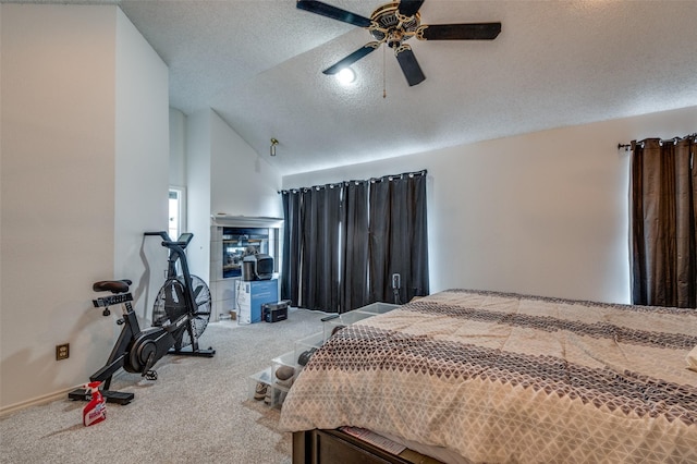 carpeted bedroom with lofted ceiling, ceiling fan, and a textured ceiling