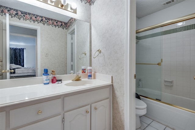 bathroom featuring wallpapered walls, toilet, enclosed tub / shower combo, tile patterned floors, and a textured ceiling