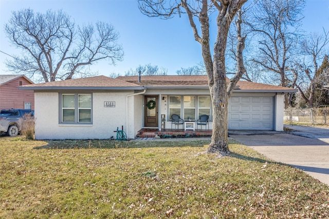 ranch-style home featuring brick siding, concrete driveway, an attached garage, a porch, and a front yard