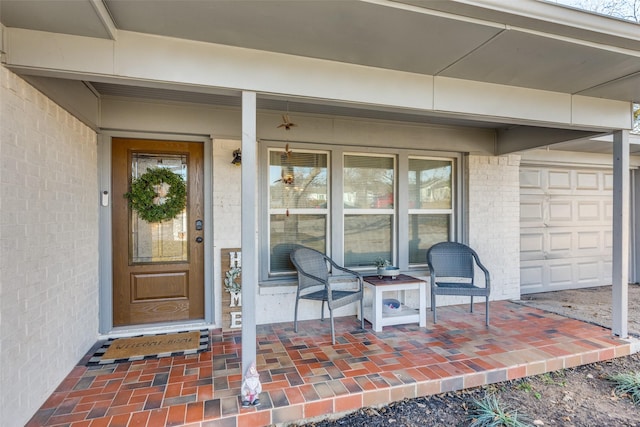 property entrance featuring brick siding