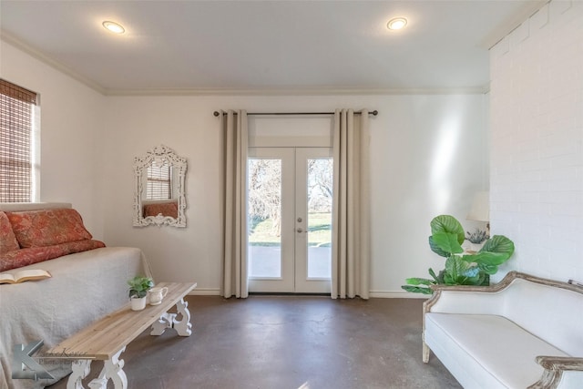 entryway with finished concrete flooring, french doors, baseboards, and crown molding