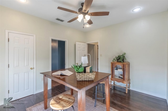 dining area featuring a ceiling fan, baseboards, visible vents, and dark wood-type flooring