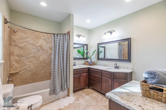 full bath with double vanity, shower / bath combo, a sink, and toilet