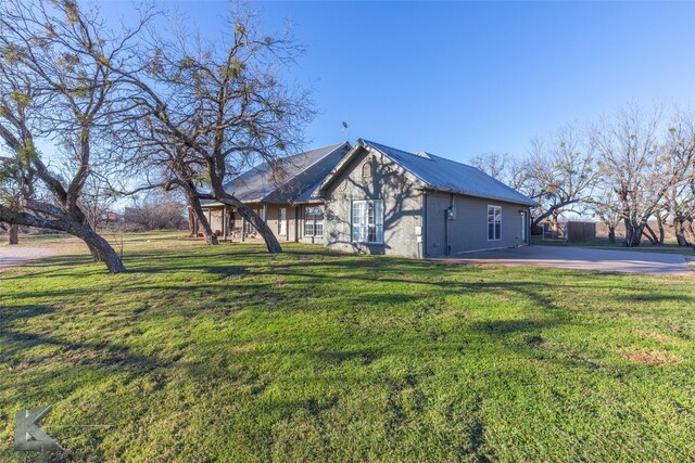 1198 Iberis Rd S Unit B, Tuscola, TX 79562 - rear view of property with french doors, a chimney, metal roof, a wooden deck, and a yard