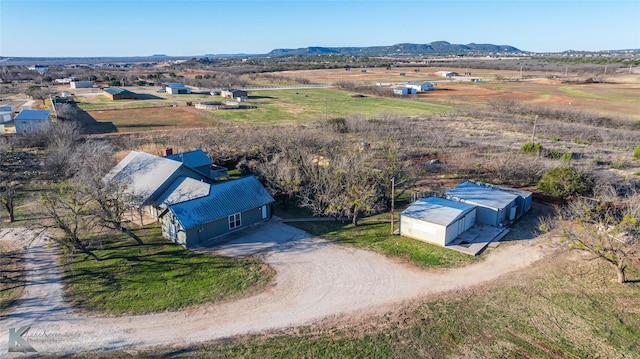 drone / aerial view featuring a rural view and a mountain view