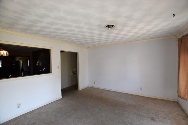 empty room with carpet floors, baseboards, visible vents, and ornamental molding