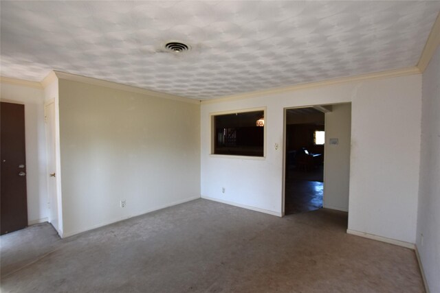 unfurnished room with carpet floors, ornamental molding, visible vents, and baseboards