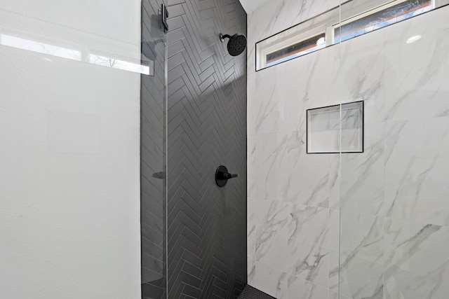 bathroom featuring tiled shower