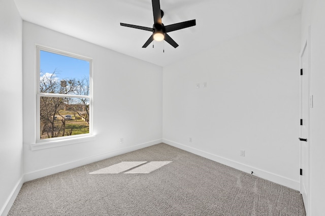 unfurnished room with ceiling fan, carpet flooring, and baseboards