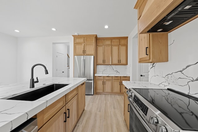 kitchen with stainless steel appliances, recessed lighting, tasteful backsplash, custom range hood, and a sink