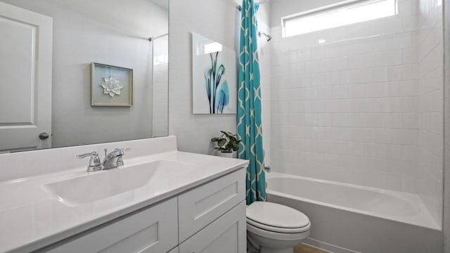 bathroom with toilet, shower / bath combo with shower curtain, and vanity