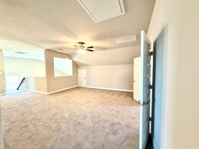 bonus room with attic access, carpet, lofted ceiling, and baseboards